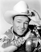 Roy Rogers portrait by his saddle tipping his hat 8x10 inch photo