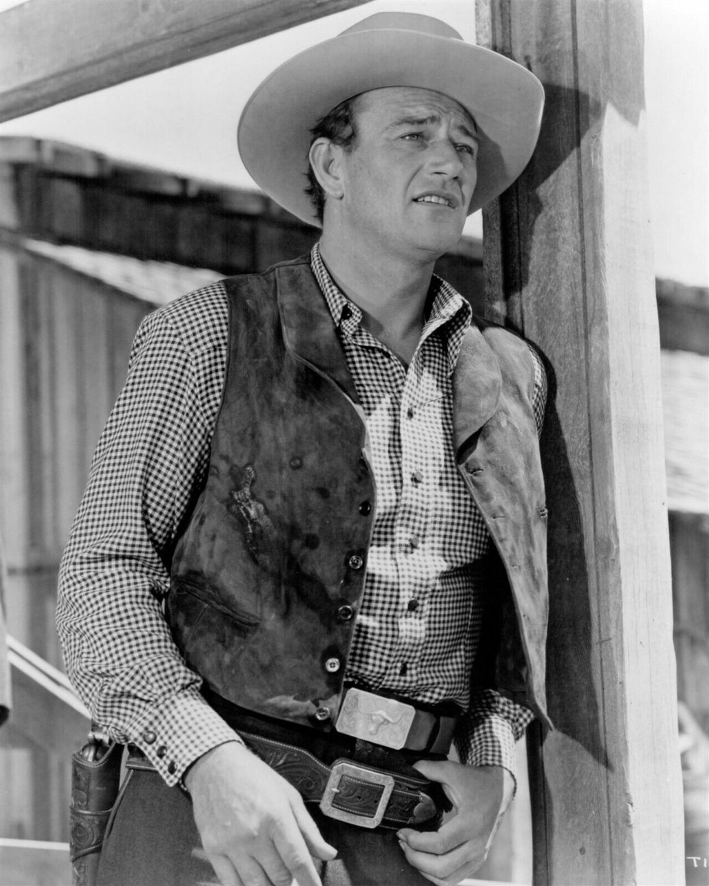 John Wayne iconic western pose in waistcoat wearing gunbelt 8x10