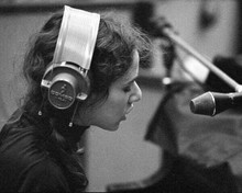 Carole King in recording session headphones on sitting at piano 8x10 photo