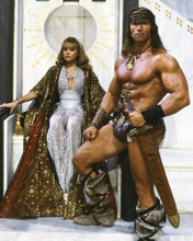 Conan The Destroyer Olivia D'Abo seated posing with Arnold Schwarzenegger 8x10 photo
