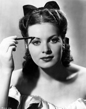 Linda Darnell 1940's portrait applying eyebrow makeup 8x10 inch photo