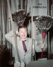 Mickey Rooney backstage holding pair of feather brooms 1940's 8x10 inch photo