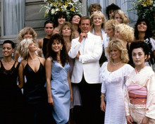 Octopussy Roger Moore poses with a bevvy of James Bond girls 8x10 inch photo