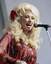 Dolly Parton 1970's in multi-colored dress singing on stage 8x10 inch photo