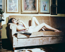 Natalie Wood shows off legs lying on sofa with cigarette holder 8x10 inch photo