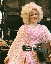 Dolly Parton on stage holding guitar mid 1970's in pink dress 8x10 inch photo