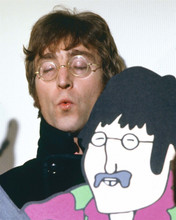 John Lennon in classic glasses holding Yellow Submarine cartoon 8x10 inch photo