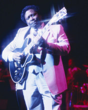 B.B. King wears white suit in concert playing guitar on stage 8x10 inch photo