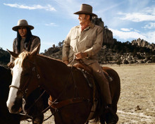 The Undefeated John Wayne sits on horseback in desert scene 8x10 inch photo