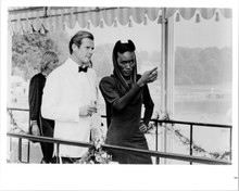 A View To A Kill Roger Moore and Grace Jones at party 8x10 photo