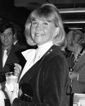 Doris Day smiling as she holds drink signing autographs 1970's 8x10 inch photo