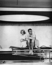 Thunderball Sean Connery sits on massage table Molly Peters behind 8x10 photo