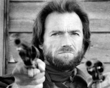 Clint Eastwood tough expression points two pistols Outlaw Josey Wales 8x10 photo