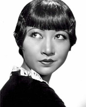 Anna Mae Wong with expression of surprise looks over her shoulder 8x10 photo