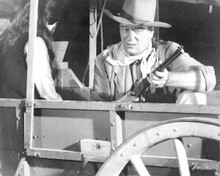 The Comancheros 1961 John Wayne in wagon with rifle & Ina Balin 8x10 photo