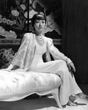 Anna Mae Wong seated on chaise lounge 8x10 inch photo