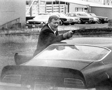 John Wayne takes aim with gun over his Pontiac Grand-Am 1974 McQ 8x10 photo