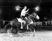 Bronco Billy 1980 Clint Eastwood riding horse in ring pointing gun 8x10 photo