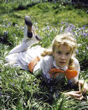 Hayley Mills in her Pollyanna outfit lying on grass 8x10 inch photo