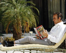 Sean Connery relaxes on Diamonds Are Forever set reading Time 8x10 photo