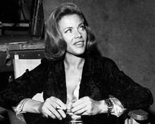 Honor Blackman seated in chair smoking cigarette on Goldfinger set 8x10 photo