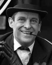 Jeremy Brett smiles as Sherlock Holmes wearing earring smoking 8x10 inch photo