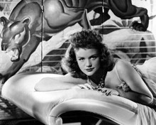 Simone Simon publicity pose for Cat People lying on sofa 8x10 inch photo