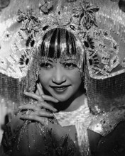 Anna Mae Wong clasps hands together smiling in elaborate head dress 8x10 photo