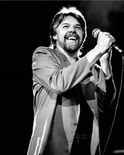 Bob Seger smiling on stage holding microphone 1980's era 8x10 inch photo