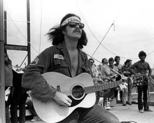 Country Joe McDonald 1969 strums his guitar at Woodstock 8x10 inch photo