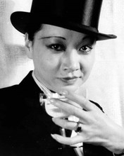 Anna Mae Wong holds champagne glass in man's top hat & tuxedo 8x10 inch photo