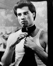John Travolta tries on priest collar Saturday Night Fever 8x10 inch photo