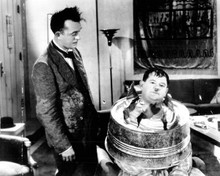 Laurel and Hardy Stan looks at Ollie with tub over his head 8x10 inch photo