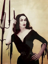 Maila Nurmi in guise as Vampira poses next to candles 8x10 inch photo