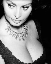 Sophia Loren displays her ample charms in black dress looks to side 8x10 photo