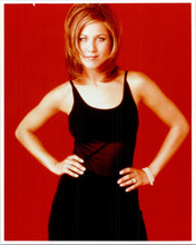 Jennifer Aniston poses in black dress hands on hips Friends 8x10 inch photo