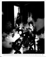 Purple Rain Prince sits on motorbike outside theater stage door 8x10 photo