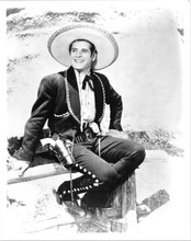 The Cisco Kid 1950's TV western Duncan Renaldo sits on fence 8x10 inch photo