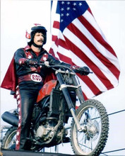 Andy Samberg 2007 Hot Rod Year riding bike by American flag 8x10 inch photo