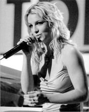 Britney Spears on stage holding microphone 8x10 inch press photo