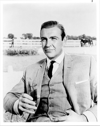 Goldfinger 8x10 inch photo Sean Connery seated enjoys cool cocktail ...
