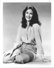 Lynda Carter 1970's era in blouse and slacks sitting on studio floor 8x10 photo