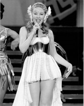 Kylie Minogue in short skirt performing on stage 8x10 inch press photo