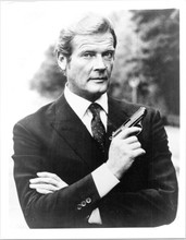 Roger Moore iconic Bond pose holding gun 8x10 inch photo