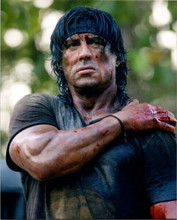 Sylvester Stallone holds injured shoulder from 2008 Rambo 8x10 inch photo