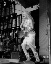 Taylor Swift in cowgirl boots on stage playing guitar 8x10 inch press photo