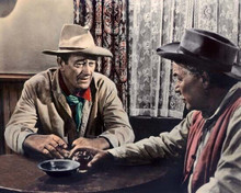 The Searchers John Wayne sits at table drinking whiskey 8x10 photo