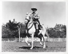 The Lone Ranger Clayton Moore smiling as he rides Silver 8x10 inch photo