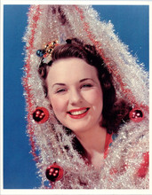 Deanna Durbin in Christmas spirit with tinsel smiling 8x10 inch photo