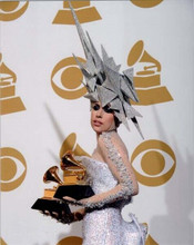 Lady Gaga holding two Grammy awards circa 2011 8x10 inch press photo